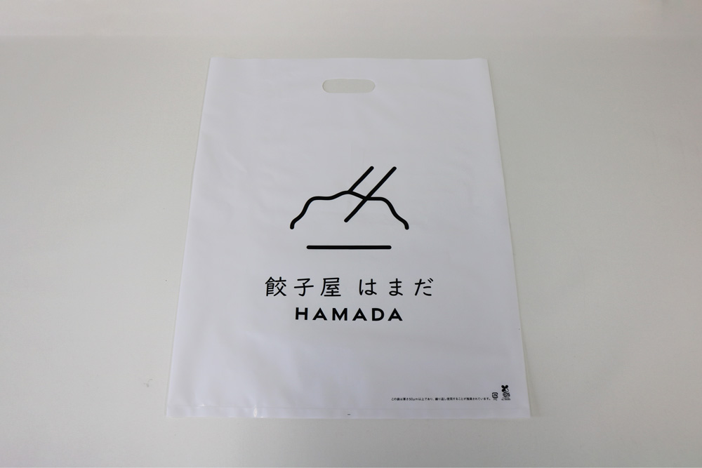 バイオマス25%LDPE(乳白)0.08㎜のグラビア印刷片面1色の小判穴抜きポリ袋の表面画像