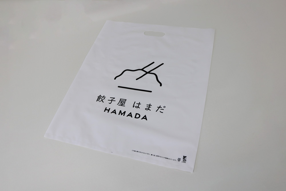 バイオマス25％LDPE（乳白）0.08㎜のグラビア印刷片面１色の小判穴抜きポリ袋