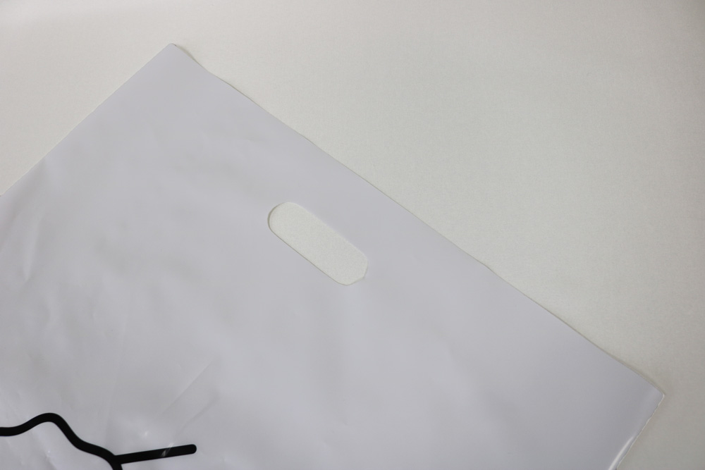 バイオマス25%LDPE(乳白)0.08㎜のグラビア印刷片面1色の小判穴抜きポリ袋の入れ口画像